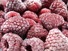 Red Raspberry Fruits / Ice Frozen Food in Winter